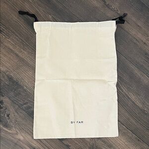 BY FAR Cream Dust Bag with Black Ties